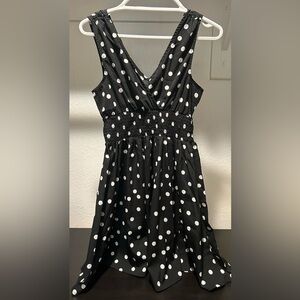 Black with white polka dot flowy dress. Worn a few times. Cinched at waist